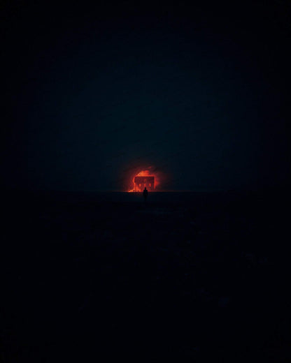 Tiny anonymous figure watching distant house fire at night for suspense book cover. Noir ilustration. Dark novel. Noir novel.